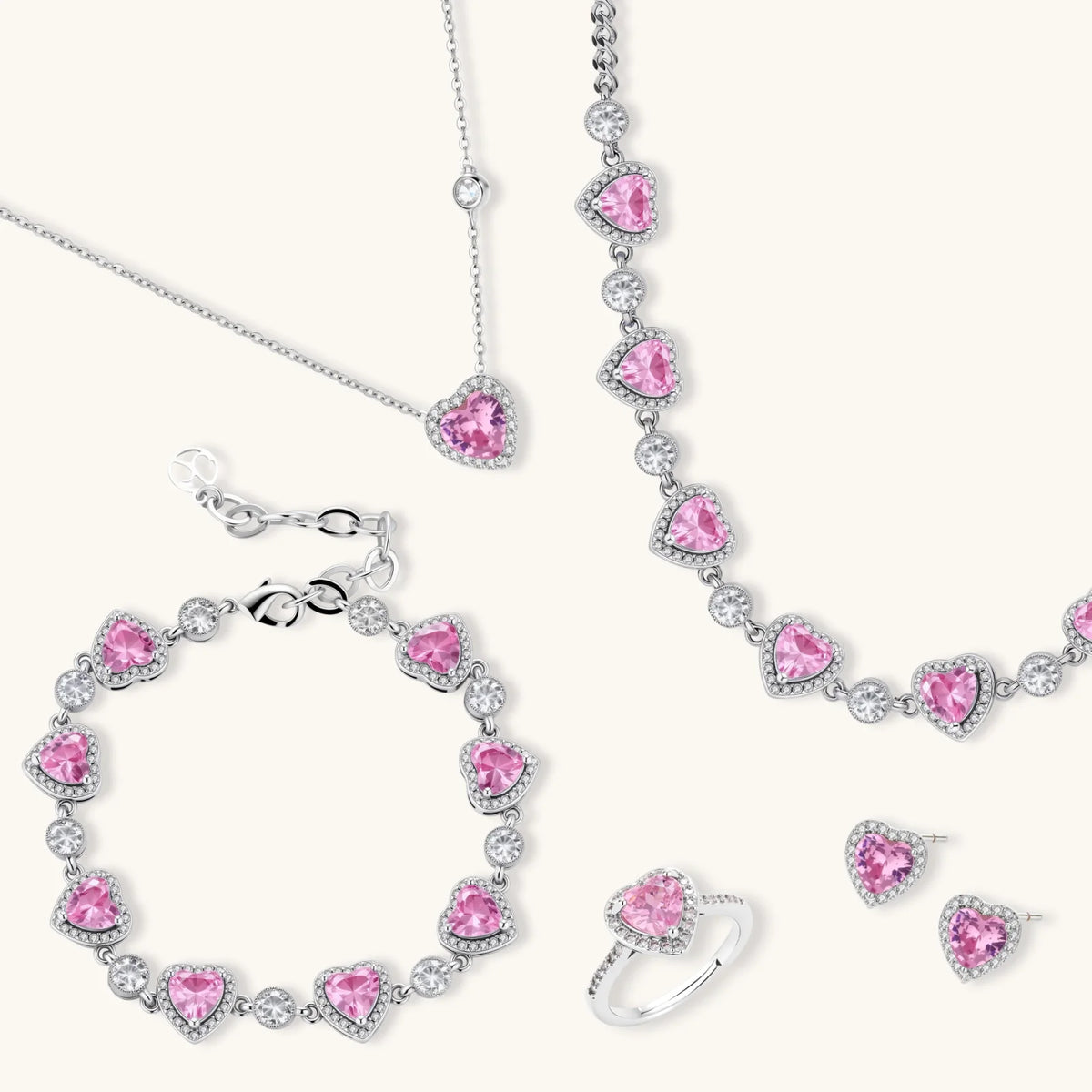 Pink heart-shaped cubic zirconia jewelry set with white gold plating featuring necklace, earrings, bracelet and ring
