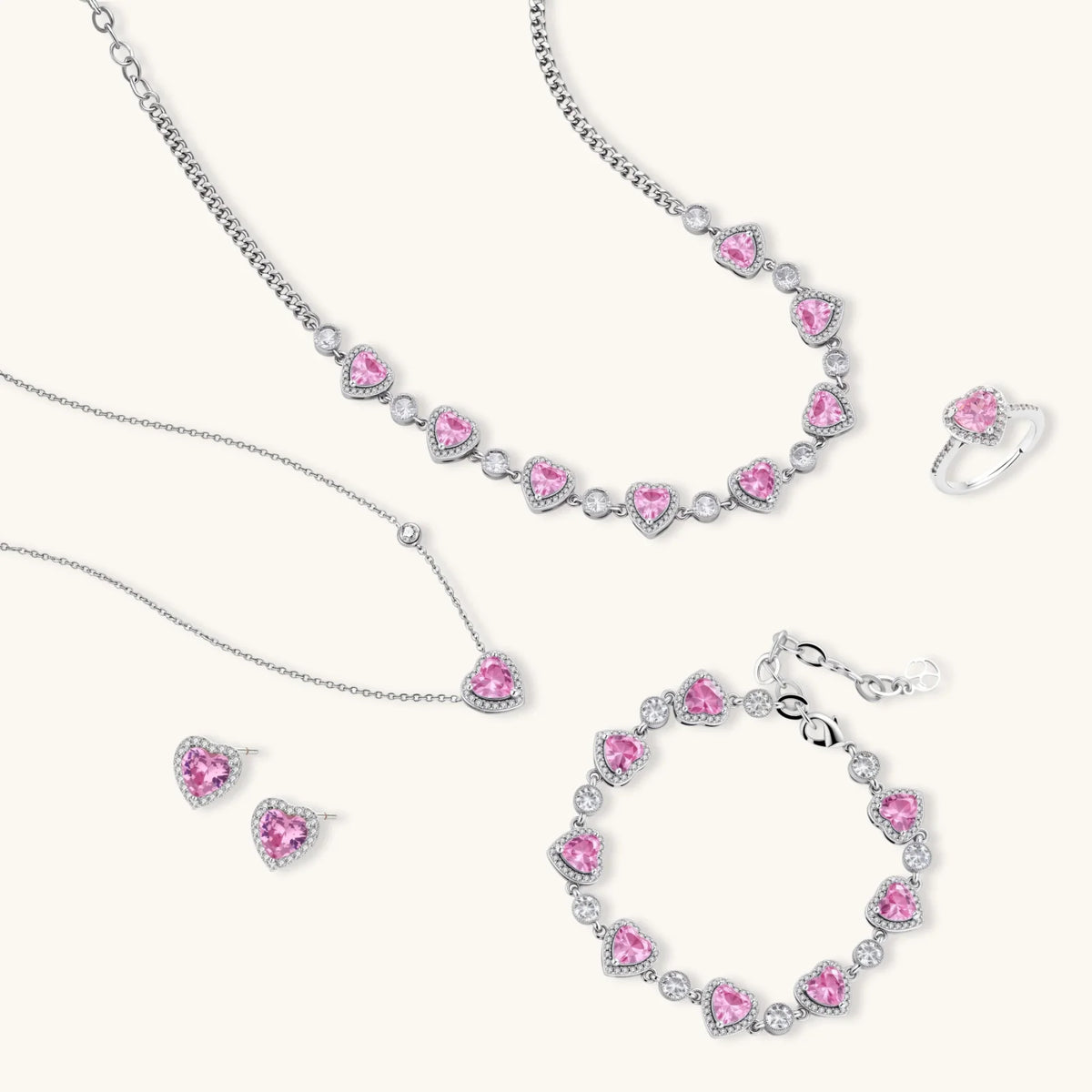Pink heart-shaped cubic zirconia jewelry set with white gold plating featuring necklace, earrings, bracelet and ring